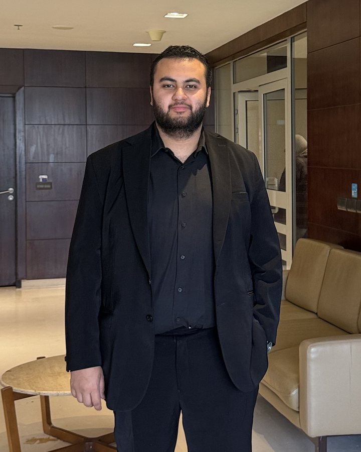 Youssef Ayoub in a dark suit at a Family Medicine conference.